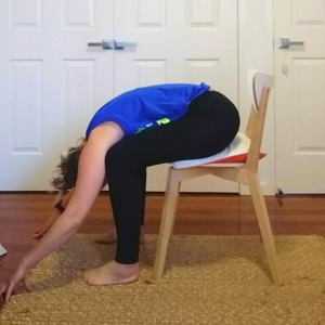 4 Yoga poses you can do at your desk.