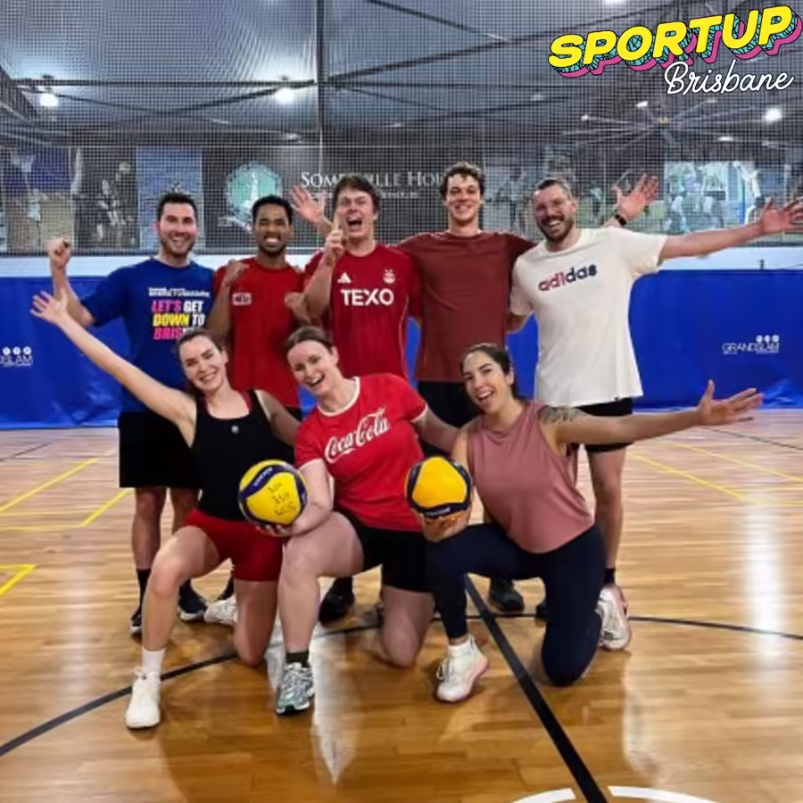 SportUP volleyball team posing with volleyballs after their game
