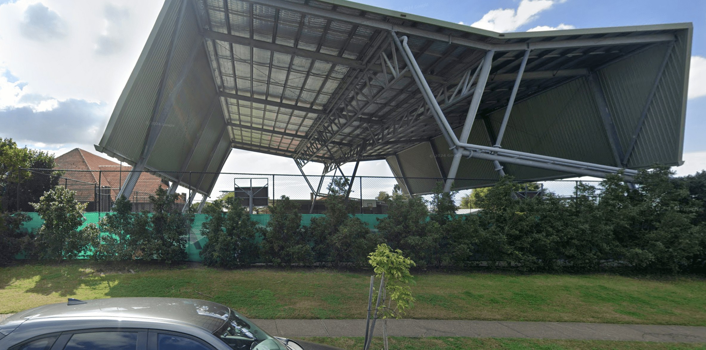 The undercover netball courts at St Oliver Plunkett School, Cannon Hill
